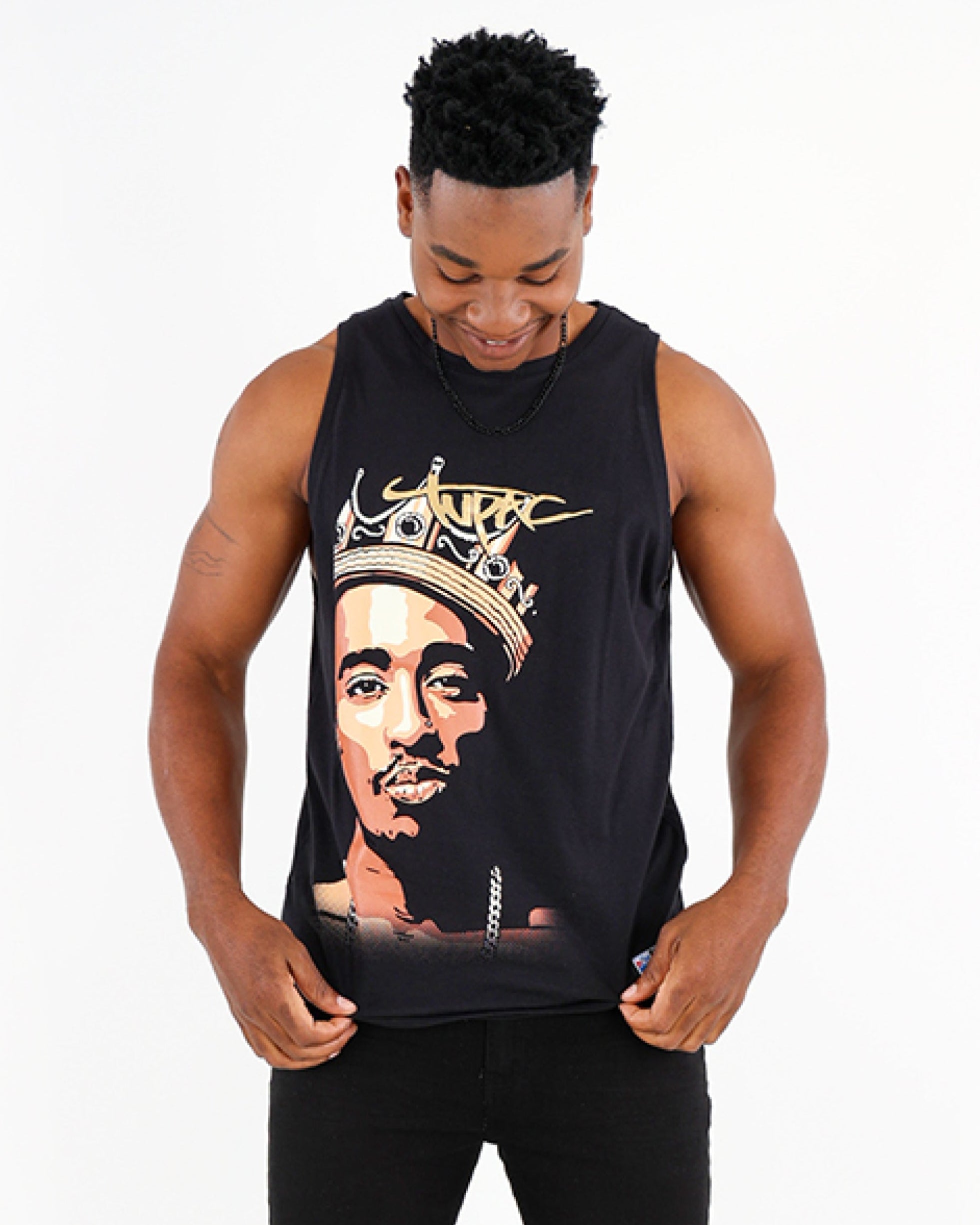 Person wearing a black tank top with a graphic design on a white background