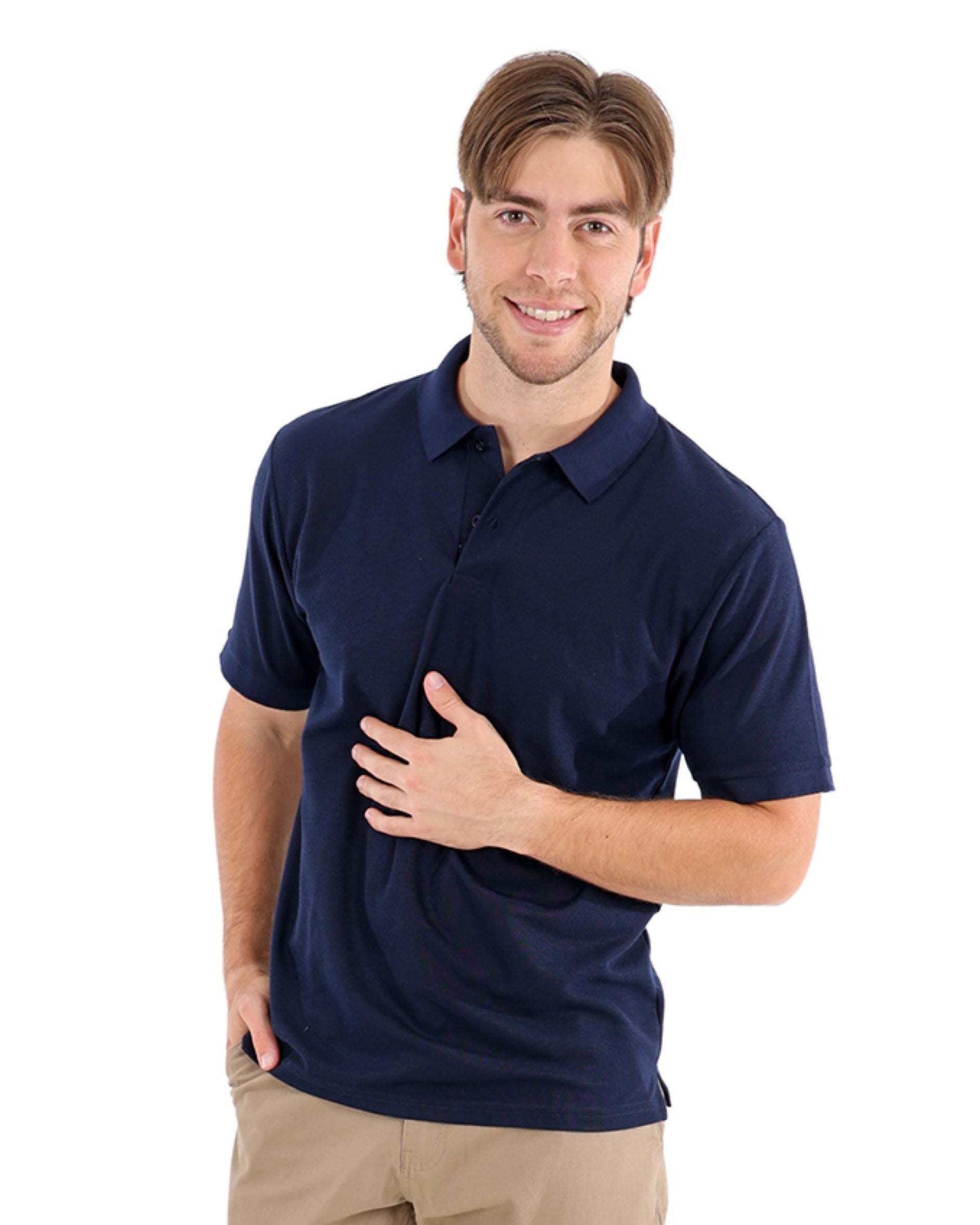 Man wearing a navy blue polo shirt and beige pants on a white background