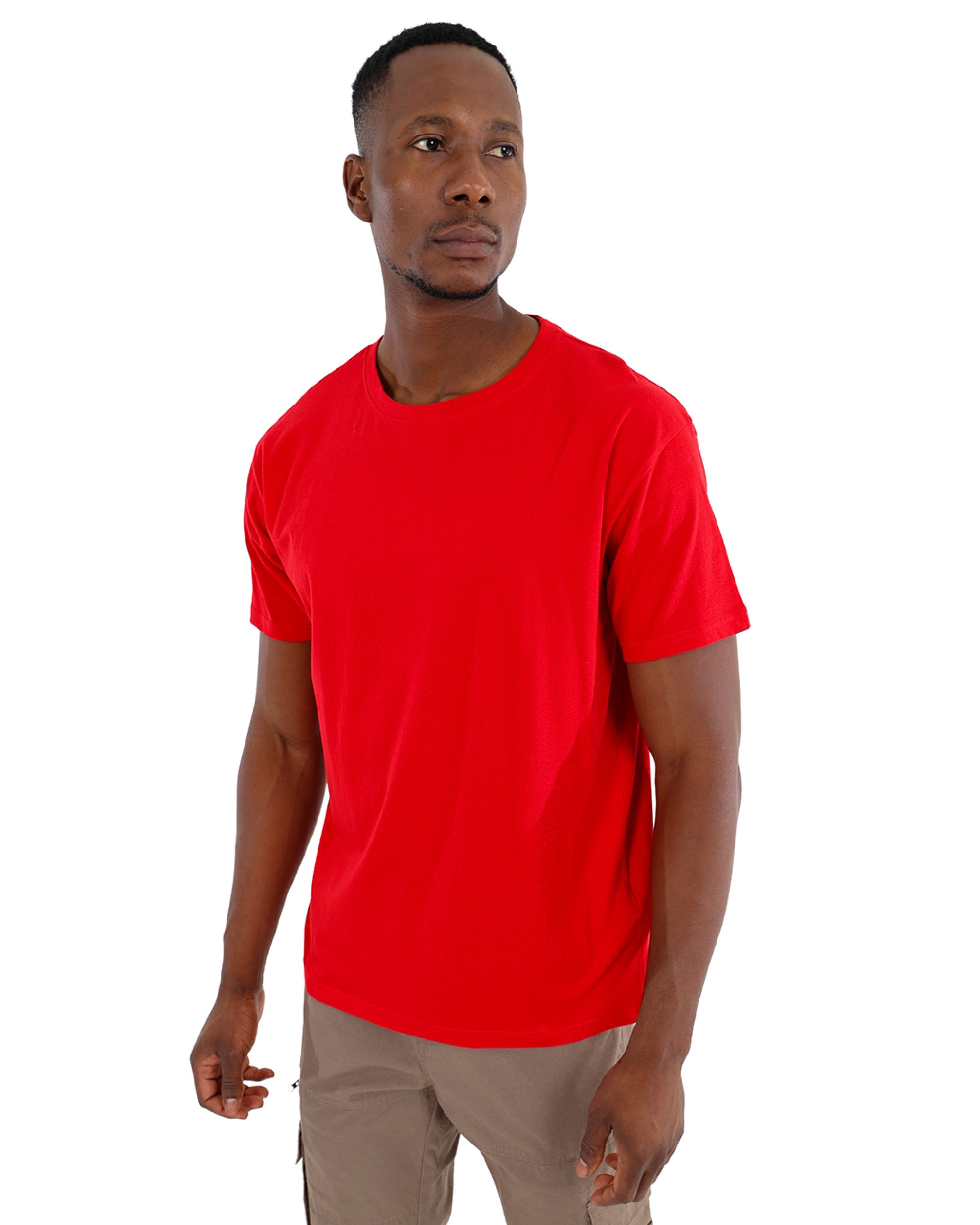 Man wearing a red t-shirt and beige cargo shorts on a white background