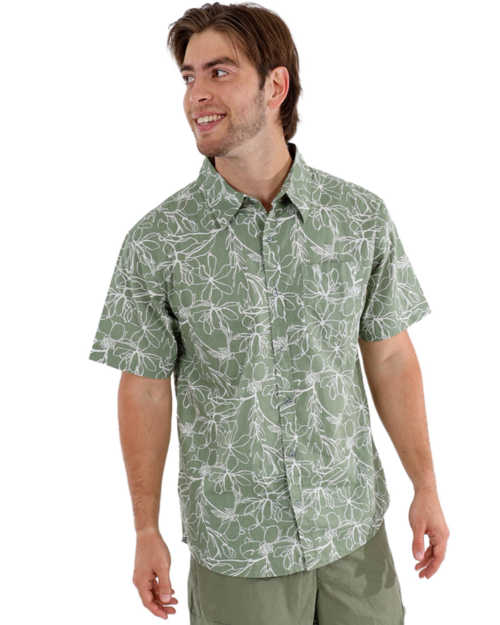 Man wearing a green patterned shirt and shorts on a white background